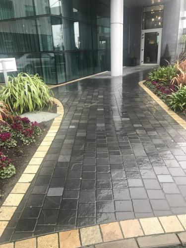 Black Limestone Tumbler 15x15 bordered With Yellow Limestone Tumbler 15x15 used at Entrance & Pathways at Crowne Plaza Hotel Blanchardstown Project